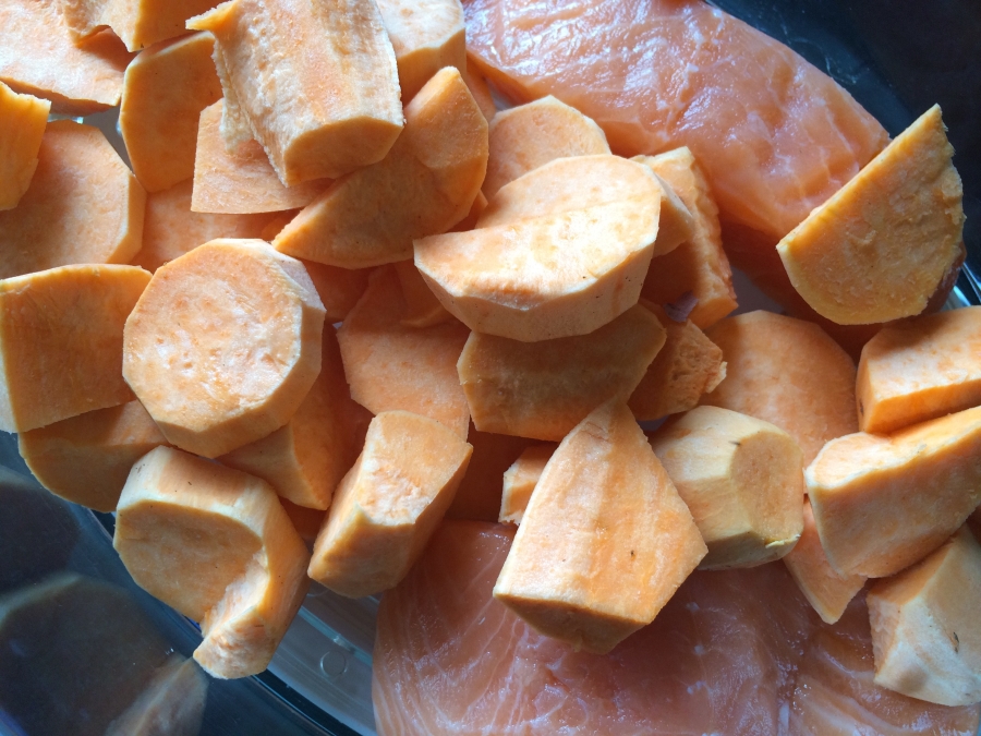 Steaming sweet potatoes and salmon